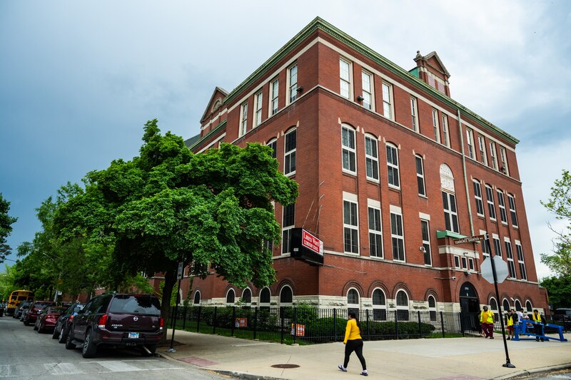 A large red brick school building.